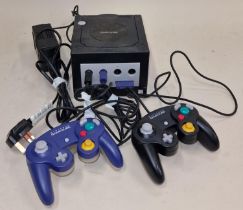 Nintendo Gamecube console with power supply and two controllers. This lot has not been tested.