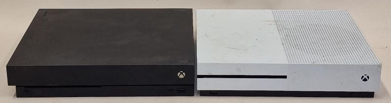 Xbox One X console together with an Xbox One S console. Units only, no leads or controllers.