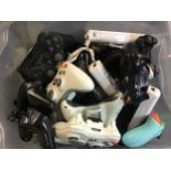 LARGE BOX OF VARIOUS HAND HELD GAMING CONTROLLERS. Makes here include - Sega - Wii - Nintendo - Sony