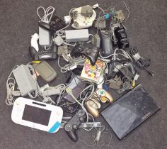 Collection of miscellaneous gaming gear to include consoles, controllers, leads and accessories.