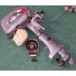 A Suzuki "4" outboard motor.