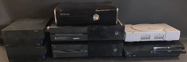 SEVEN VARIOUS GAMING CONSOLES. This collection includes 2 X XBOX Ones - 2 x Sony PlayStation 2’s,