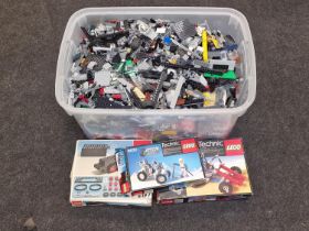 Large tub of loose Lego bricks.