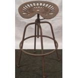 A Tractor seat stool (132)