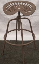 A Tractor seat stool (132)