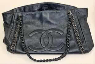 A black ladies leather handbag inconclusively marked.