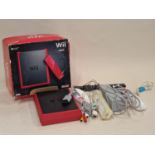 Wii mini console in original box with some accessories. This lot has not been tested.