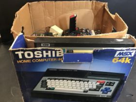 TOSHIBA HOME COMPUTER WITH A BOX OF GAMES. This computer is model No. HX-10 and comes complete