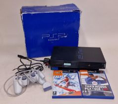 Boxed Sony PlayStation 2 with controller, power lead and two games. This lot has not been tested.