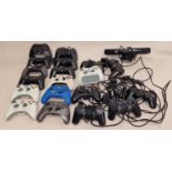 Collection of game console controllers to include PlayStation and Xbox examples. Wired and wireless.