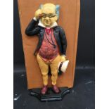 A Mr. Pickwick doorstop. (128)