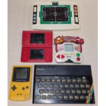 Collection of handheld gaming items to include Nintendo DS Lite, Game Boy Colour, Sinclair ZX