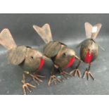 Three tinplate robins. (150)