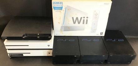 COLLECTION OF VARIOUS GAMING CONSOLES. This box contains a boxed Wii plus 3 x Sony PlayStation 2’s