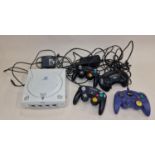 Sega Dreamcast console together with power supply and a number of controllers. This lot has not been