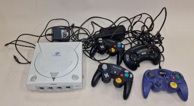 Sega Dreamcast console together with power supply and a number of controllers. This lot has not been