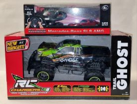 New bright Trail Ghost boxed radio controlled truck together with a boxed Mercedes-Benz SLS AMG