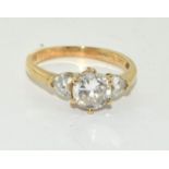 9ct Round cut central stone set accented by two heart shape stones. Size N