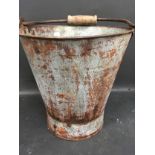 A pail with wooden handle. (190)