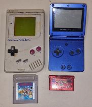 Handheld gaming: Nintendo Game Boy together with a Nintendo Game Boy Advance SP and two game