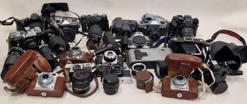 Very large collection of vintage cameras, lenses and other ancillary items.