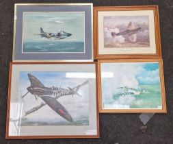 Collection of framed and glazed military aircraft prints.