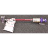 Dyson Cyclone v10 total clean cordless vacuum cleaner with attachments.