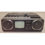 Vintage Hitachi combination Cassette/Radio/TV portable boombox. This lot is untested.