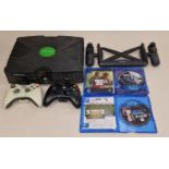 Microsoft Xbox console together with two controllers, two PS4 games and an accessory. This lot has