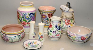 A collection of mid to late 20thC Poole Pottery in the traditional pattern. Nine pieces in lot