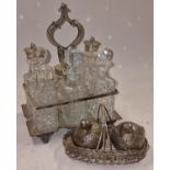 A crystal glass and silver plated vintage condiment set to include six bottles together with a