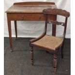 Single draw leather top writing table standing on tapered supports together a rattan seated chair