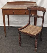 Single draw leather top writing table standing on tapered supports together a rattan seated chair