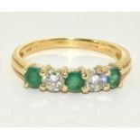 Diamond approx 0.20 each stone and 3 emeralds set in 18ct gold ring Size R, 4g