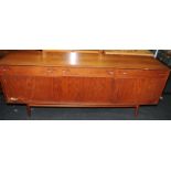 Large mid century teak sideboard by Dalescraft consisting of 3 drawers over 2 door cupboard and drop