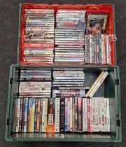 Two trays containing a large collection of DVD's.