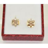 Diamond daisy style earrings set in 18ct gold and boxed.