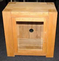 Contemporary solid oak entertainment unit with glazed hinged door including three glass shelves.