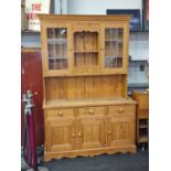 Contemporary 2 part pine kitchen dresser having glassed upper cupboards and triple spice draws