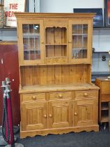 Contemporary 2 part pine kitchen dresser having glassed upper cupboards and triple spice draws