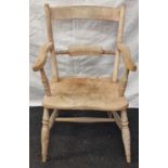 Vintage early Elm curved back dining chair standing on turned supports and H cross stretcher