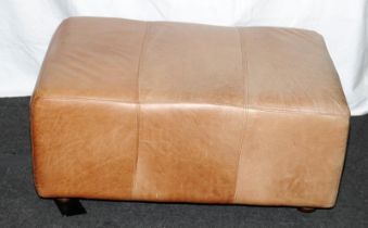 Large and faded Ottoman in tan leather. 90cms x 40cms x 62cms