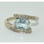 9ct white gold ladies Aquamarine and diamond sweep ring size O