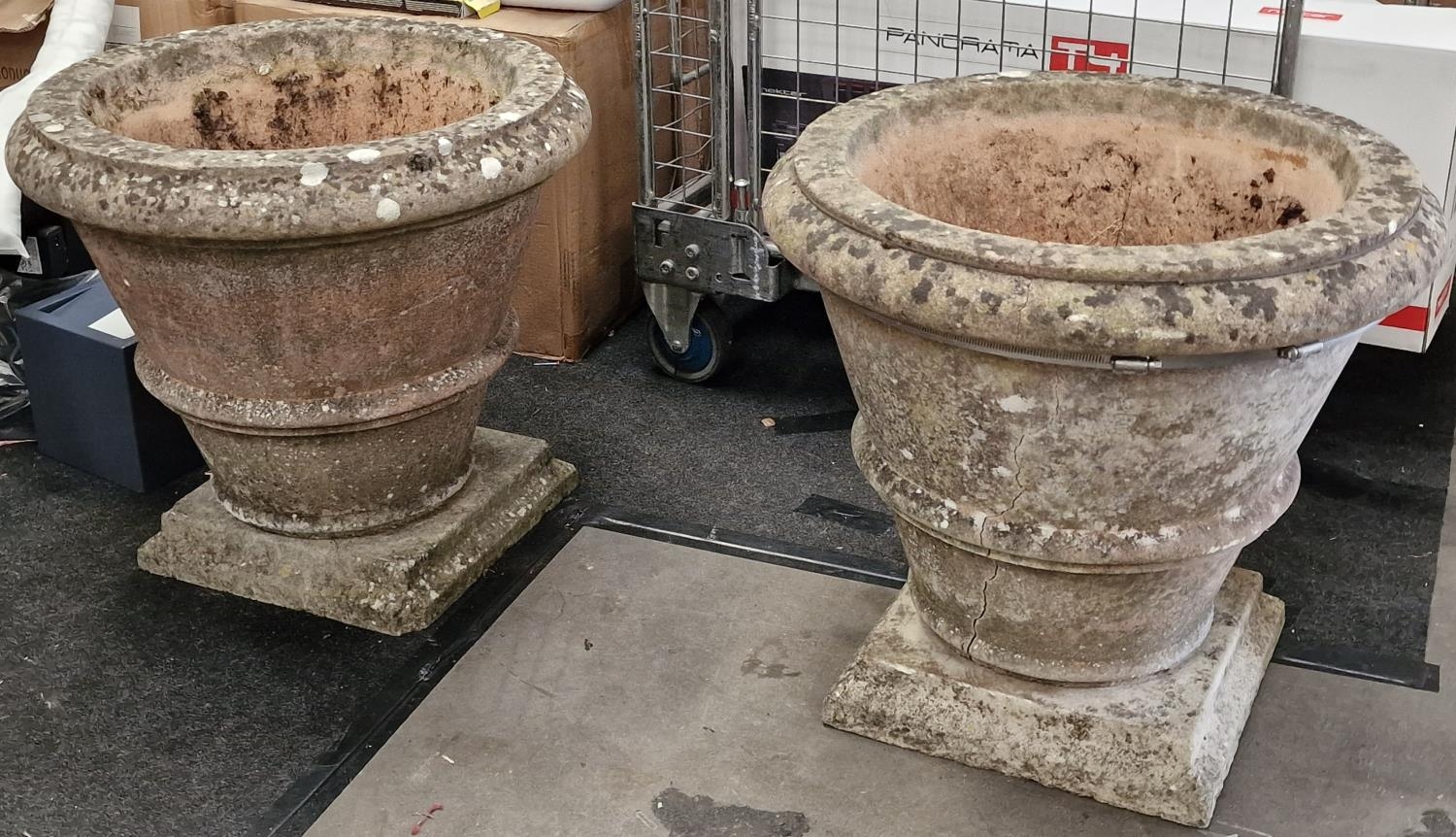 Pair of vintage reconstituted concrete garden urns on bases each 57cm high and 61cm diameter at