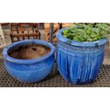 Two blue terracotta plant pots the largest measuring 50cm tall with a 48cm diameter.