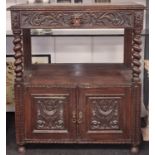 Heavily carved possibly "Green Man" twin door buffet with twisted columns and top draw 125x100x60cm