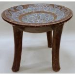 Wooden tribal design side table with internal decoration 37cm tall.