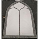 A Wide arched outdoor mirror. (161)