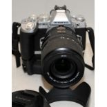 Olympus OM-D EM-1 digital SLR camera with Leica D Vario-Elmar 1:3.8-5.6 14-50mm lens fitted