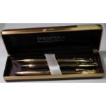 Cased Shaeffer White Dot set comprising gold plated ballpoint pen and two propelling pencils